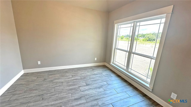 unfurnished room with light wood-type flooring