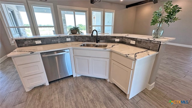 kitchen with dishwasher, light wood-type flooring, sink, and white cabinets