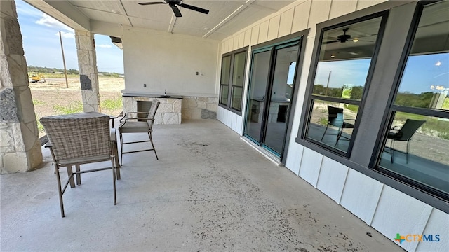 view of patio / terrace featuring ceiling fan