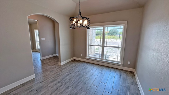interior space with a chandelier and light hardwood / wood-style flooring