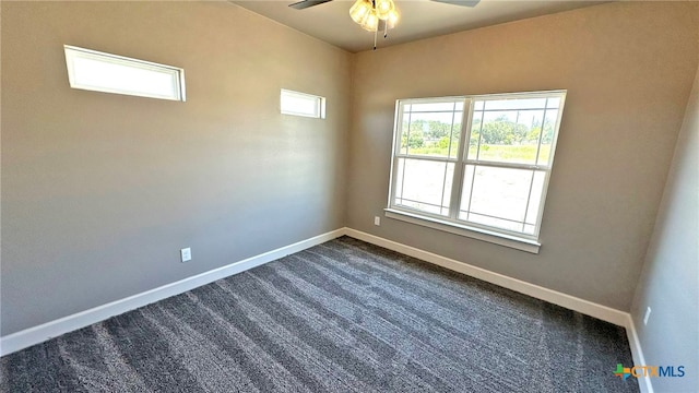 spare room with carpet and ceiling fan