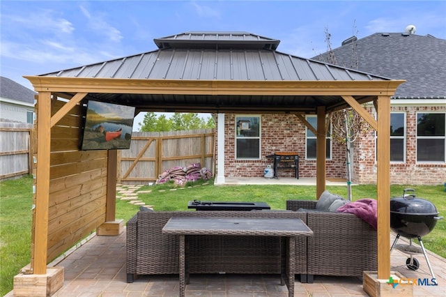 view of patio / terrace with a gazebo and fence