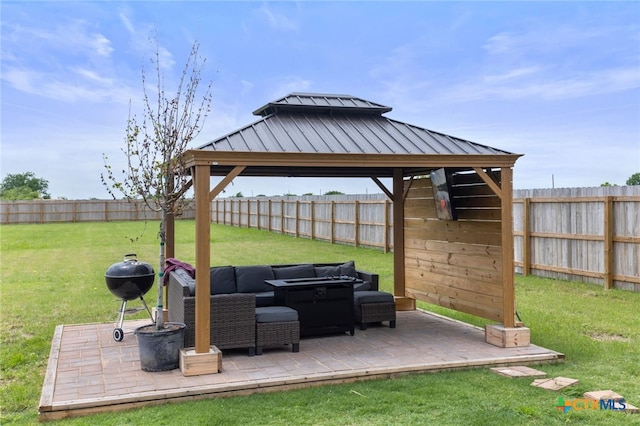 view of patio / terrace with a gazebo, a fenced backyard, and a grill