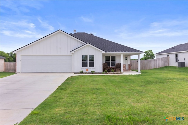 ranch-style home featuring board and batten siding, central AC, a front yard, and fence