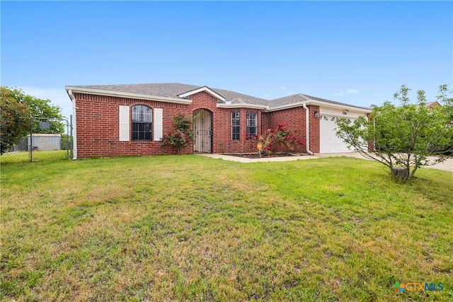 ranch-style home with brick siding, fence, a front lawn, and an attached garage