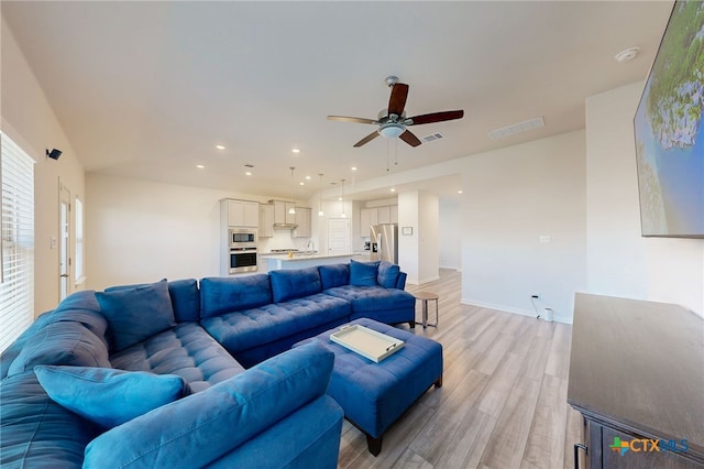 10259 Juniper Oaks, Boerne, TX 78006 - living area featuring light wood-style floors, ceiling fan, and recessed lighting