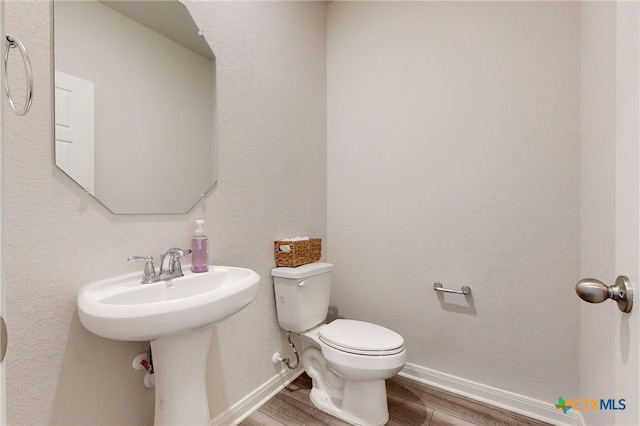 10259 Juniper Oaks, Boerne, TX 78006 - half bathroom with wood finished floors and toilet