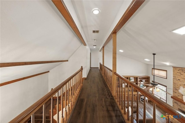 hall featuring visible vents, beamed ceiling, wood finished floors, and recessed lighting