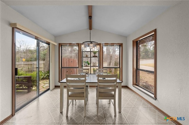 sunroom with lofted ceiling with beams and plenty of natural light