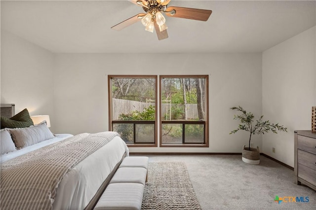 bedroom featuring ceiling fan, carpet floors, and baseboards