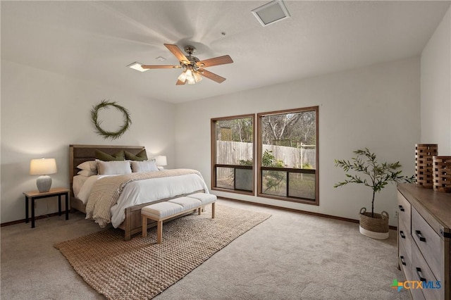 carpeted bedroom featuring a ceiling fan and baseboards