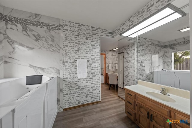 bathroom featuring vanity and wood finished floors