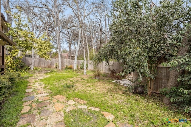 view of yard with a fenced backyard