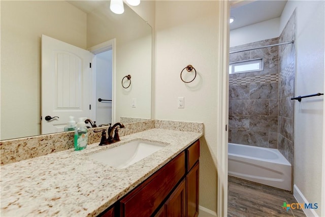 1040 Vista Dr, Salado, TX 76571 - full bath featuring baseboards, vanity, wood finished floors, and tub / shower combination