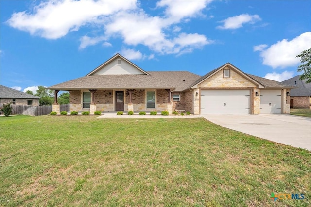 1040 Vista Dr, Salado, TX 76571 - view of front of home featuring concrete driveway, an attached garage, fence, and a front lawn