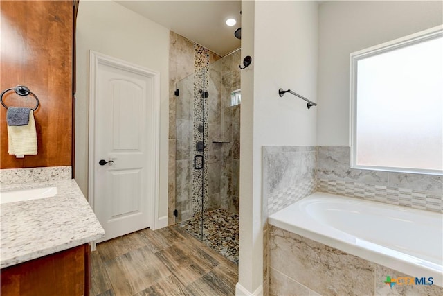 1040 Vista Dr, Salado, TX 76571 - bathroom with recessed lighting, a bath, a shower stall, and vanity