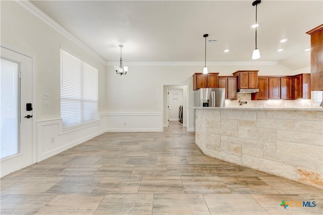 1040 Vista Dr, Salado, TX 76571 - kitchen featuring plenty of natural light, stainless steel refrigerator with ice dispenser, ornamental molding, and an inviting chandelier