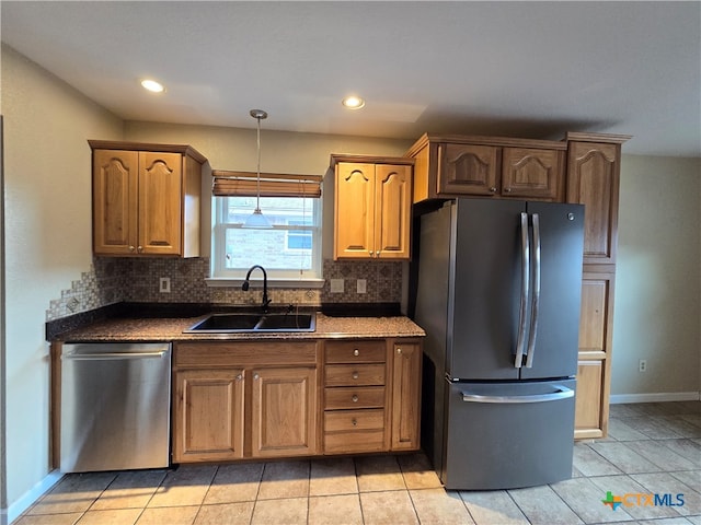 kitchen with stainless steel appliances, sink, tasteful backsplash, and light tile patterned floors