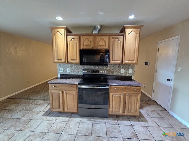 kitchen with stainless steel electric range oven, backsplash, and light tile patterned floors