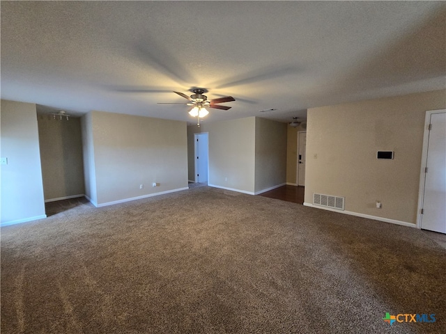 carpeted empty room with a textured ceiling and ceiling fan