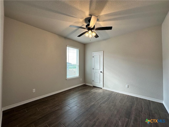 3002 Gryffindor Ln, Killeen, TX 76549 - spare room featuring dark wood-type flooring, a ceiling fan, and baseboards