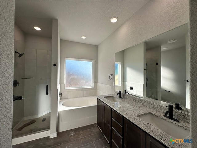 bathroom featuring separate shower and tub, tile patterned floors, and vanity