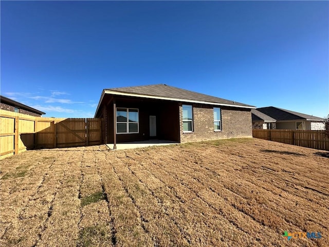 rear view of house featuring a patio