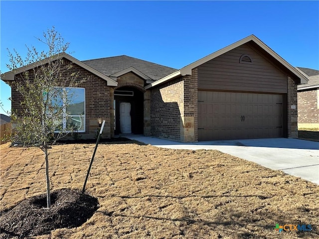 single story home with a garage