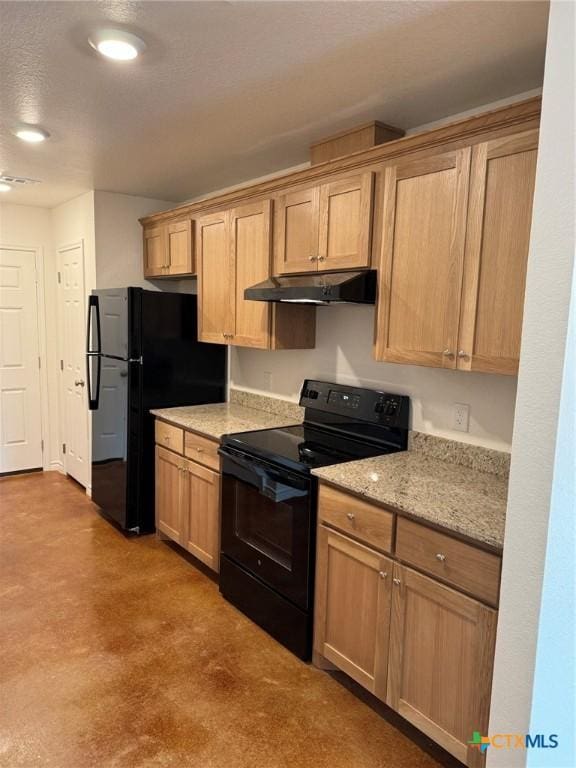 kitchen with light stone countertops and black appliances