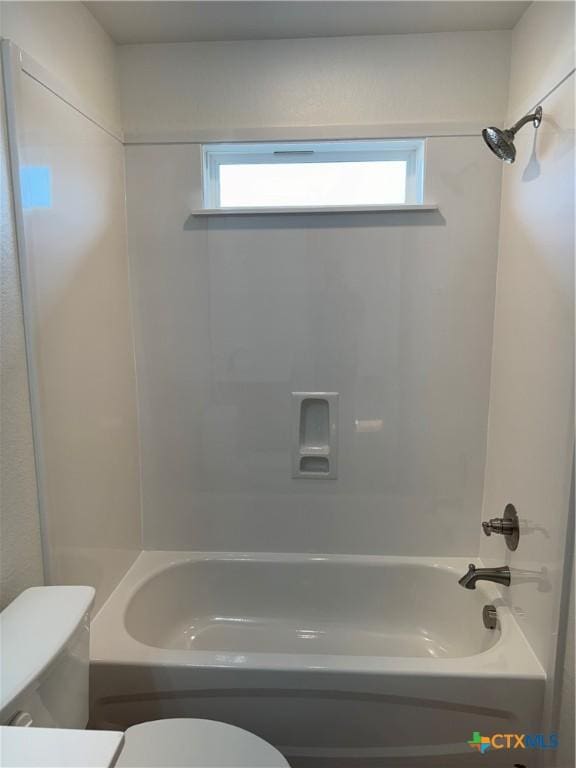 bathroom with a healthy amount of sunlight, toilet, and  shower combination