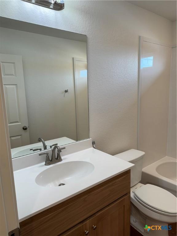 full bathroom with vanity, toilet, and shower / bathing tub combination