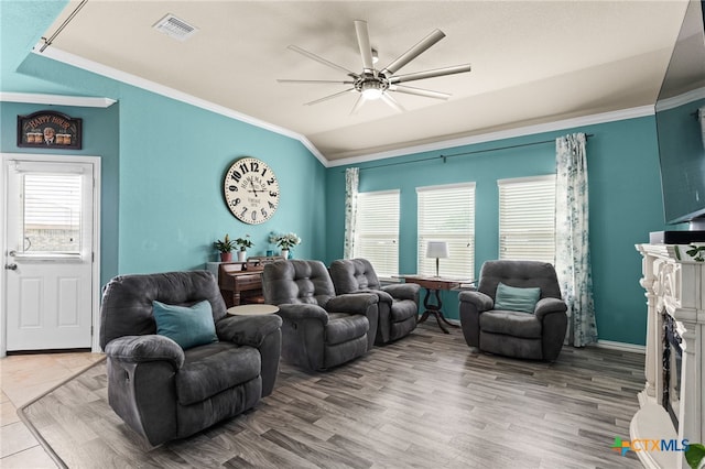 3700 Joyce Ln, Killeen, TX 76549 - living area with lofted ceiling, crown molding, ceiling fan, a fireplace, and wood finished floors