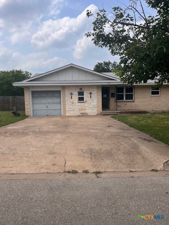 single story home featuring a garage