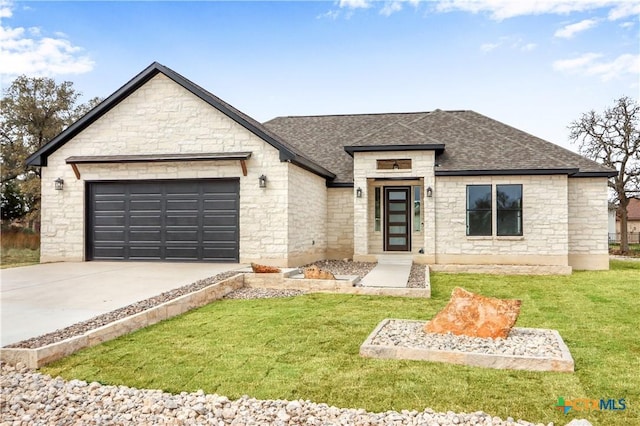 view of front facade with a garage, driveway, a shingled roof, and a front yard