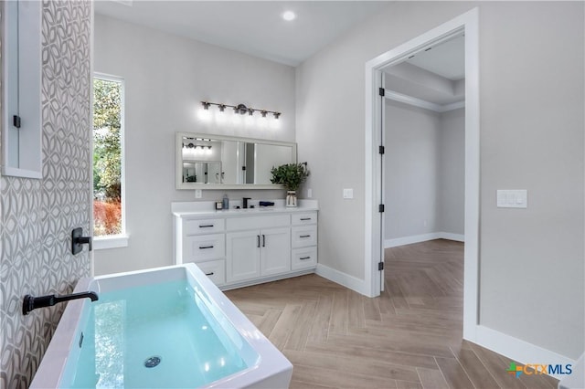 bathroom featuring baseboards and vanity