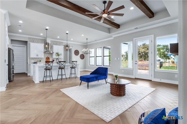 living area featuring baseboards, beam ceiling, recessed lighting, and visible vents