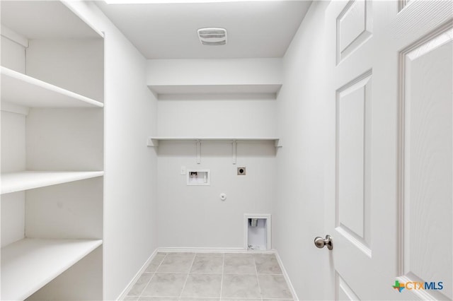 laundry room with gas dryer hookup, light tile patterned flooring, washer hookup, and hookup for an electric dryer