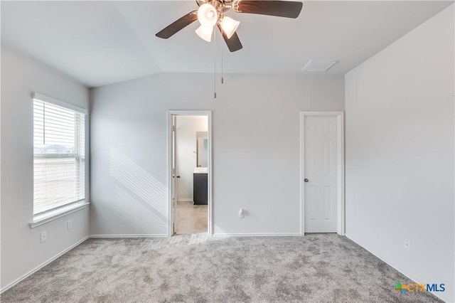9019 Stonehollow Rd, Temple, TX 76502 - unfurnished bedroom with vaulted ceiling, carpet, baseboards, connected bathroom, and a ceiling fan