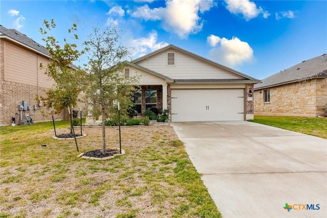 view of front of home featuring a front yard and a garage