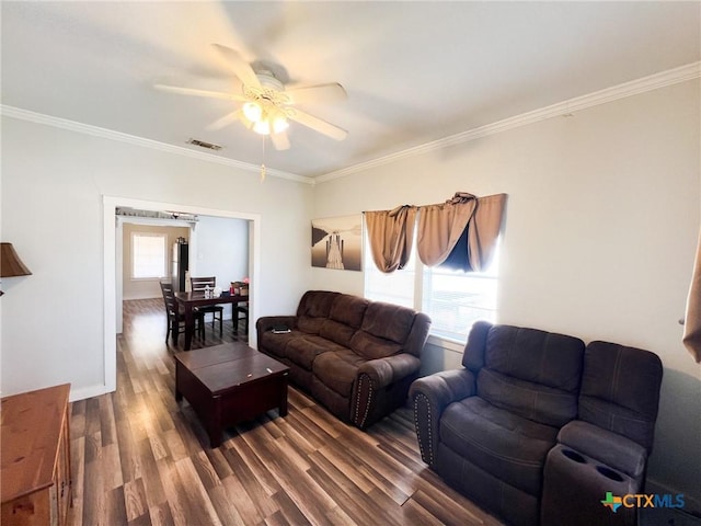 living room featuring crown molding, ceiling fan, and dark hardwood / wood-style flooring