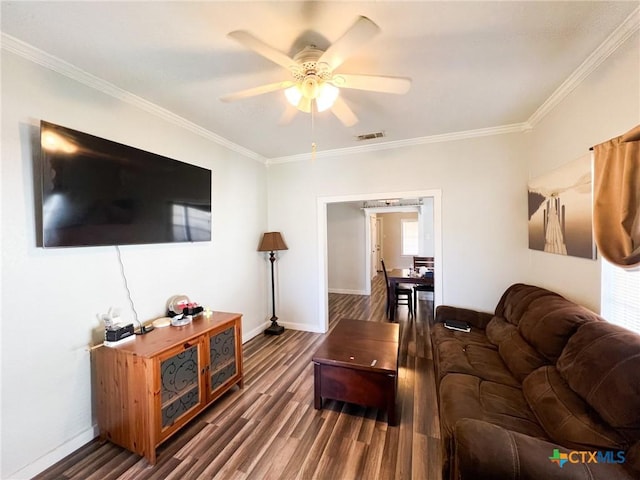 living room with crown molding, ceiling fan, and dark hardwood / wood-style flooring