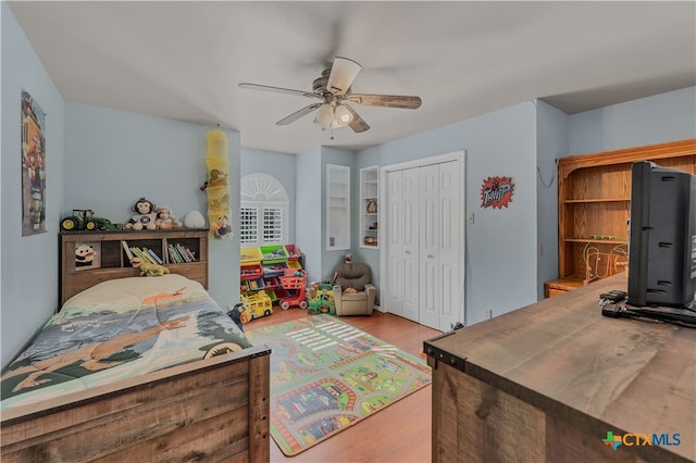 bedroom featuring a closet, ceiling fan, and light hardwood / wood-style flooring