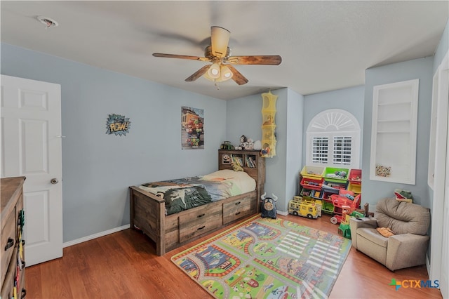 bedroom featuring hardwood / wood-style flooring and ceiling fan