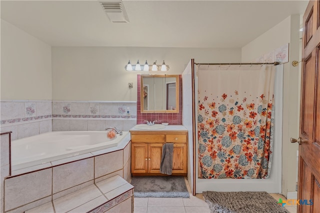 bathroom with vanity, independent shower and bath, and tile patterned floors