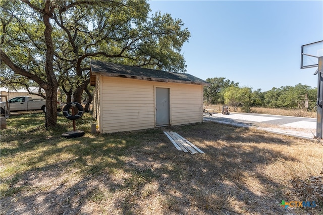 view of outdoor structure with a lawn