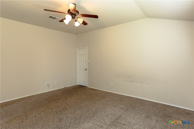 empty room with ceiling fan, vaulted ceiling, and carpet