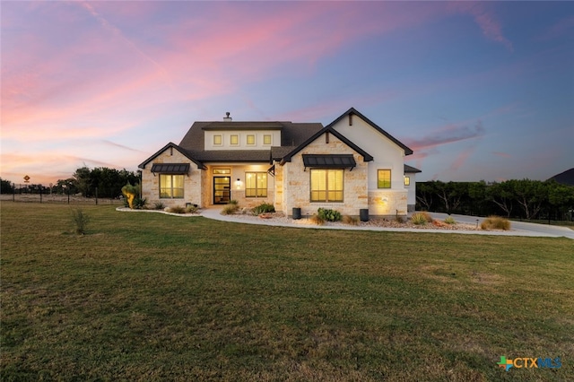 view of front of house with a lawn