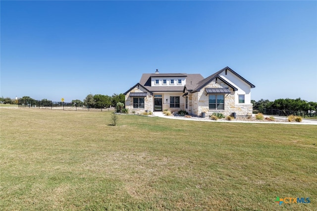 craftsman-style home featuring a front yard