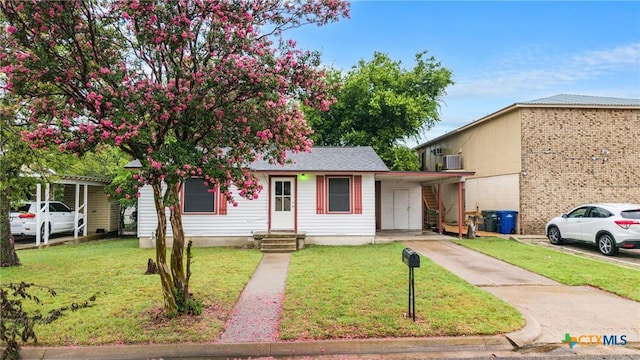 804 Little St, Copperas Cove, TX 76522 - view of front of home featuring driveway, an attached carport, and a front lawn