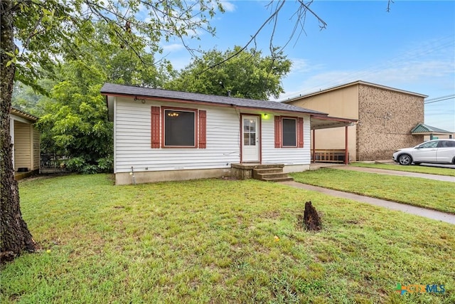 804 Little St, Copperas Cove, TX 76522 - view of front of house featuring concrete driveway, a front yard, and an attached carport